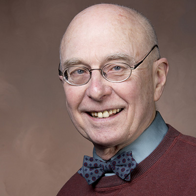 Chuck Anderson - older man with glasses a bow tie and nice sweater