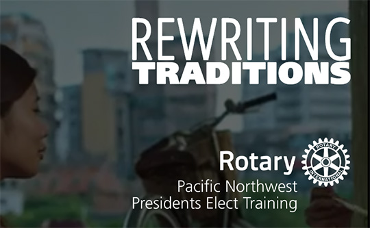 faded photo of person looking into the urban distance with white text on top Rewriting Traditions Rotary Pacific Northwest PETS Training